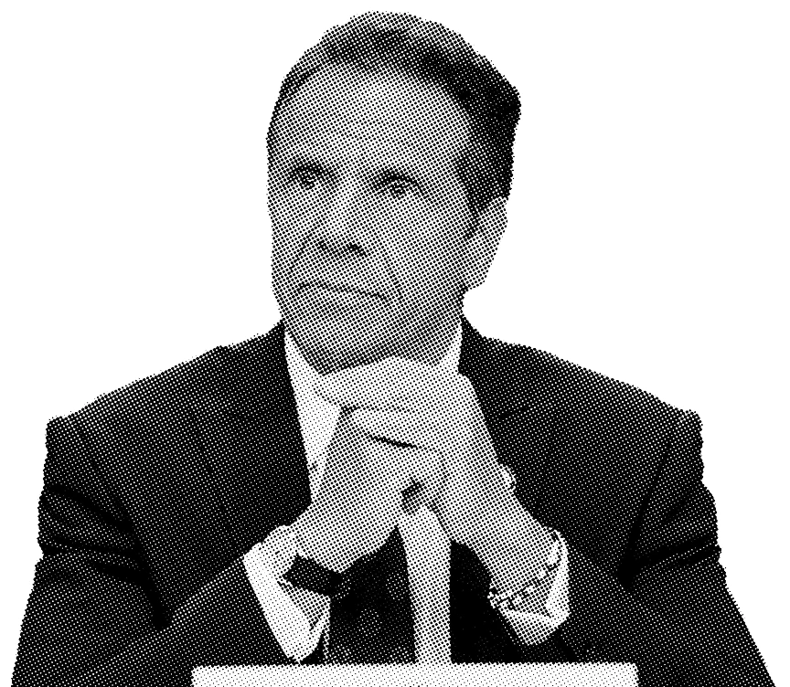Black and white portrait of Andrew Cuomo in a suit, hands together, serious expression.